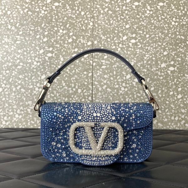 Valentino Garavani  small Locò embellished denim shoulder bag.BW01