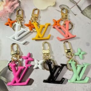 Pop flower signature Keyring gold tone metal.JW01