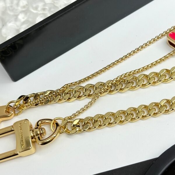 Golden Chain belt made of pearls, beads,metallic letters that spell out VU!TT0N.JW01 - Image 4