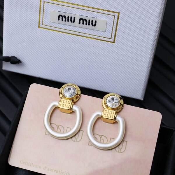 M!u M!U Acrylic golden Earrings.JW01