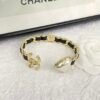Golden bracelet with Leather CC logo and Heart .JW01