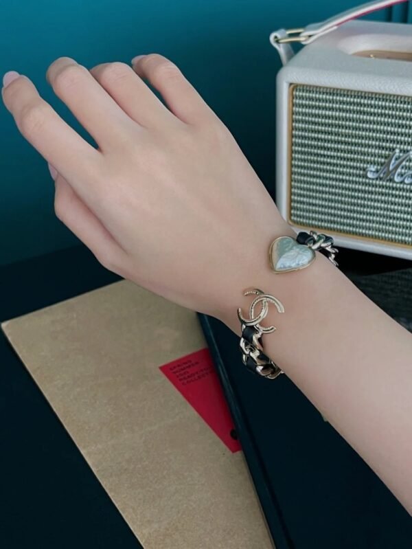 Golden bracelet with Leather CC logo and Heart .JW01 - Image 8