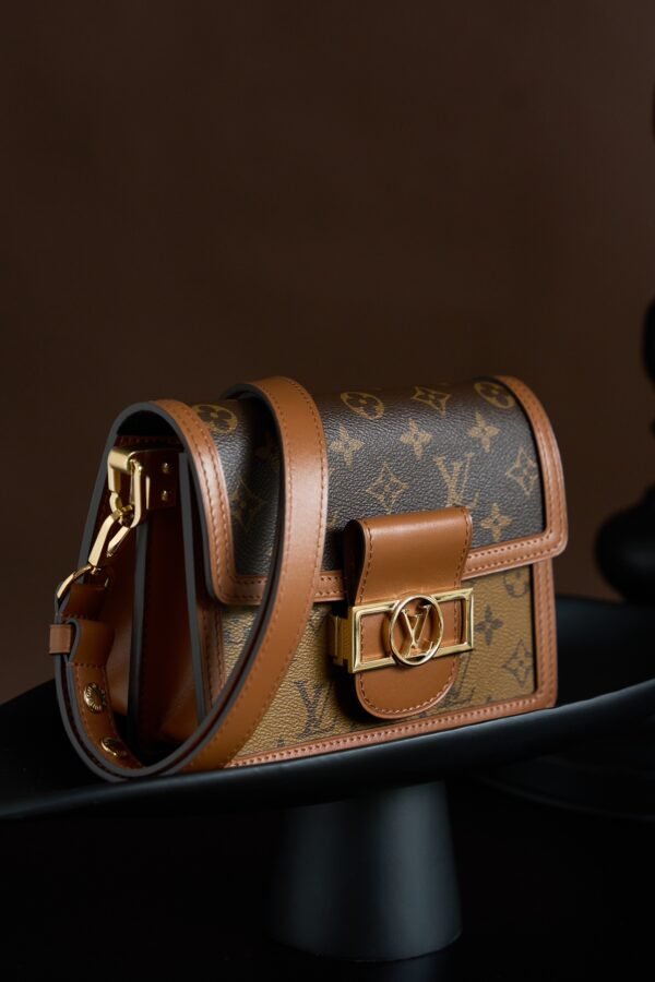 Mini Dauphine Handbag monogram Reverse canvas, trimmed with cowhide-leather.