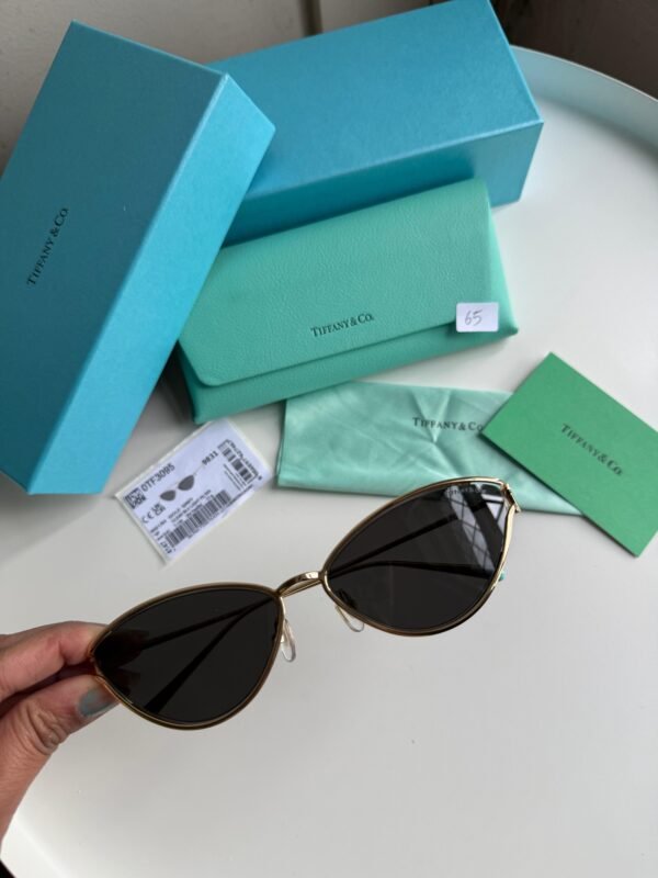 Sunglasses in Pale Gold-colored Metal with Black cat-eye shaped lenses. - Image 4