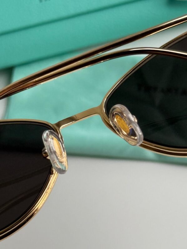 Sunglasses in Pale Gold-colored Metal with Black cat-eye shaped lenses. - Image 6