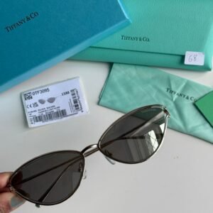 Sunglasses in Silver coloured Metal with Light Grey Silver Mirror cat-eye shaped lenses.
