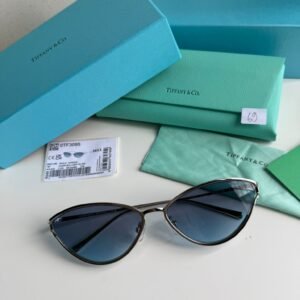 Sunglasses in Silver coloured Metal with Light Blue cat-eye shaped lenses.