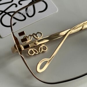 Alternative view of High-quality metal rimmed Golden frame, simple yet sophisticated rectangular glasses for women.