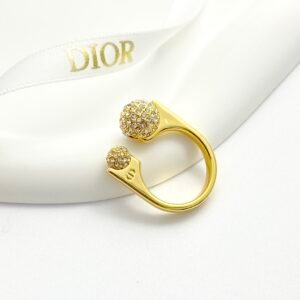 Gold-plated metal ring with unique Diamond covered balls design.