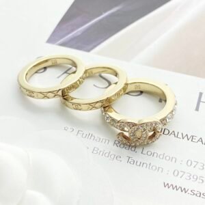 Alternative view of Gold diamond double c three-piece ring.
