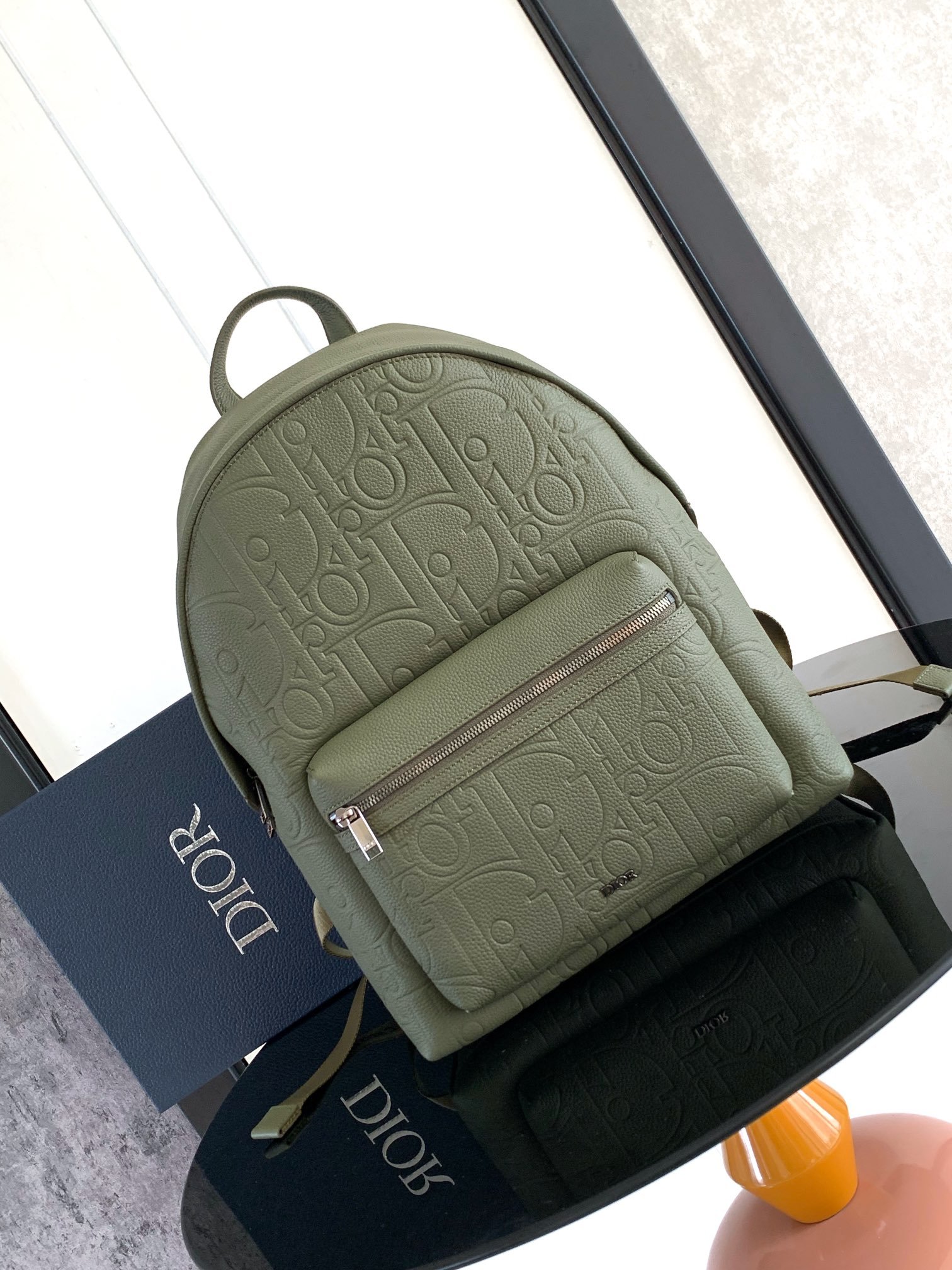 Olive green Rider 2.0 backpack embossed cowhide leather with printed effect.