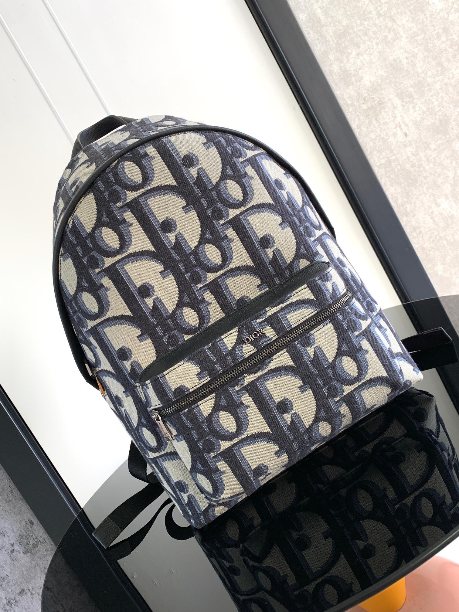 Classic college style "Rider" backpack embossed cowhide leather with printed effect.