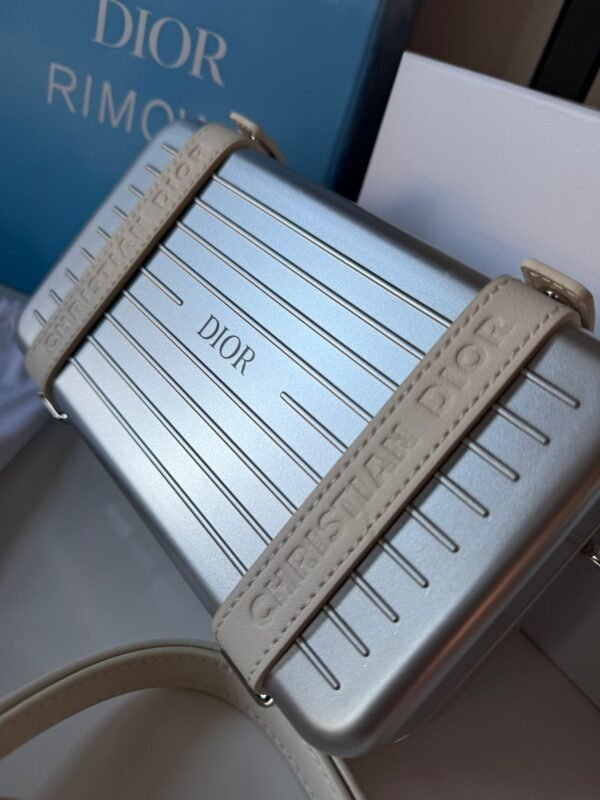 Spring 2020 Personal Clutch On Strap lightweight aluminum with logo-embossed leather straps, refined interior layout with compartments, card slots, and a zippered pocket. - Image 14