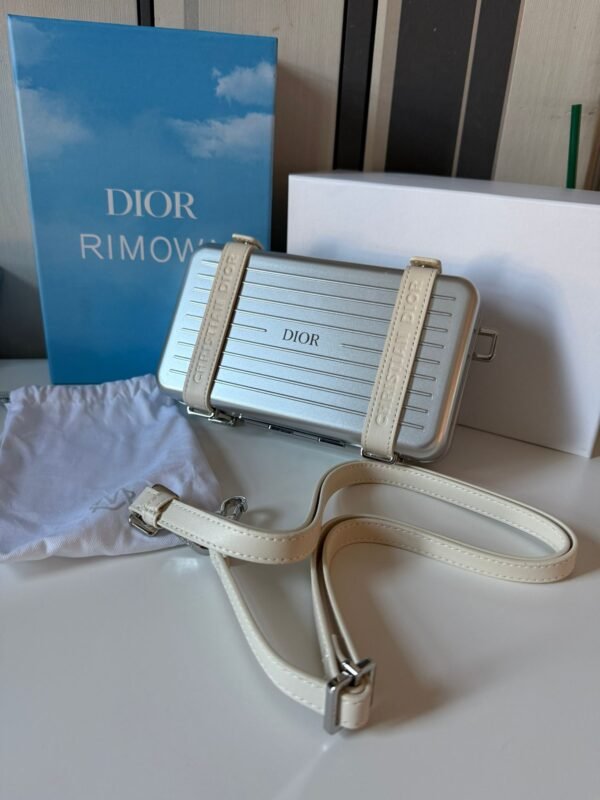 Spring 2020 Personal Clutch On Strap lightweight aluminum with logo-embossed leather straps, refined interior layout with compartments, card slots, and a zippered pocket. - Image 7