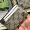 Beige and ebony GG Supreme canvas card holder with leather trim Brass hardware with ceramic-effect finish.
