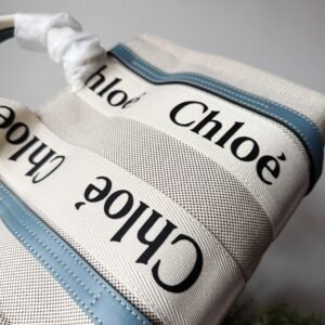 Alternative view of Small Woody tote bag in  shiny calfskin and linen white and blue small bag on the arm, shoulder or cross-body.