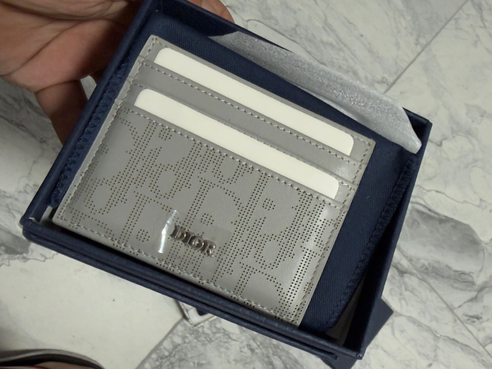 Oblique Jacquard (6 Slot) Card Holder Gray grained calfskin.