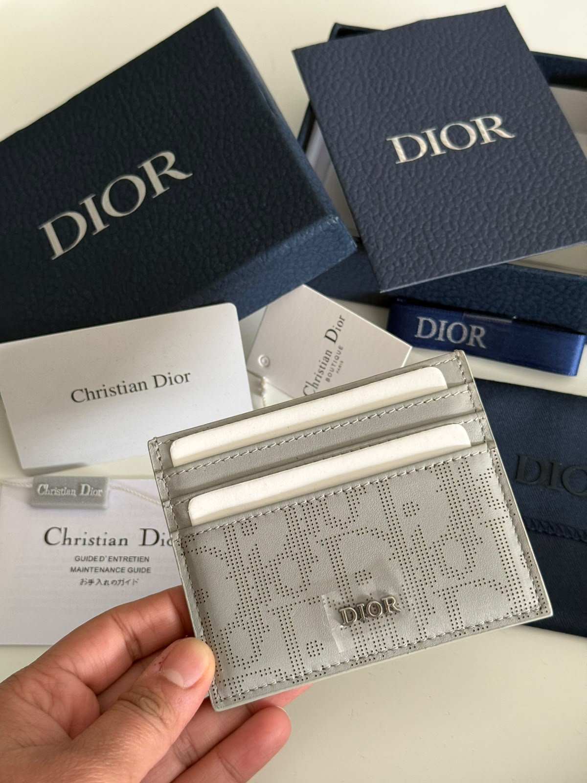 Oblique Jacquard (6 Slot) Card Holder Gray grained calfskin.
