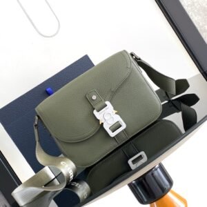 Saddle flap messenger bag made with Olive grained cowhide and adjustable nylon shoulder strap.