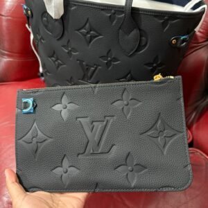 Alternative view of Genuine Leather Neverfull MM Black tote bag with a matching pouch, both featuring embossed monogram pattern.