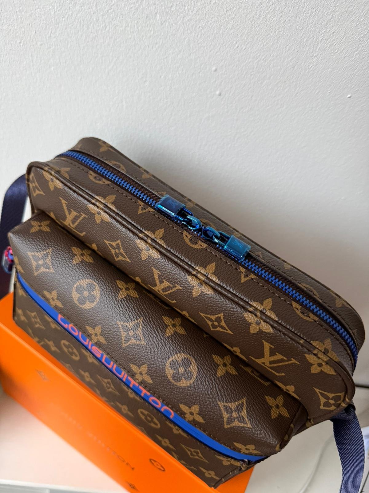 Limited edition Classic brown Monogram canvas compact cross-body bag with blue zip and blue hardware. - Image 10