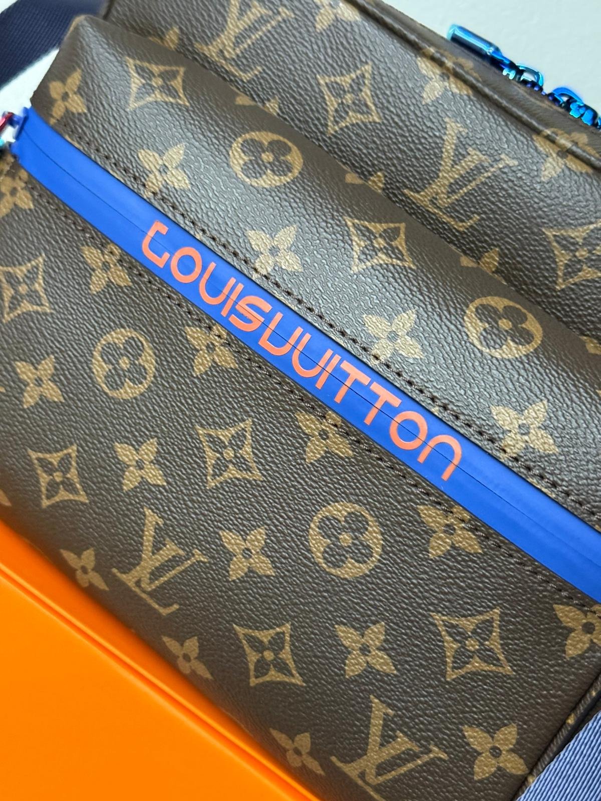 Limited edition Classic brown Monogram canvas compact cross-body bag with blue zip and blue hardware. - Image 9