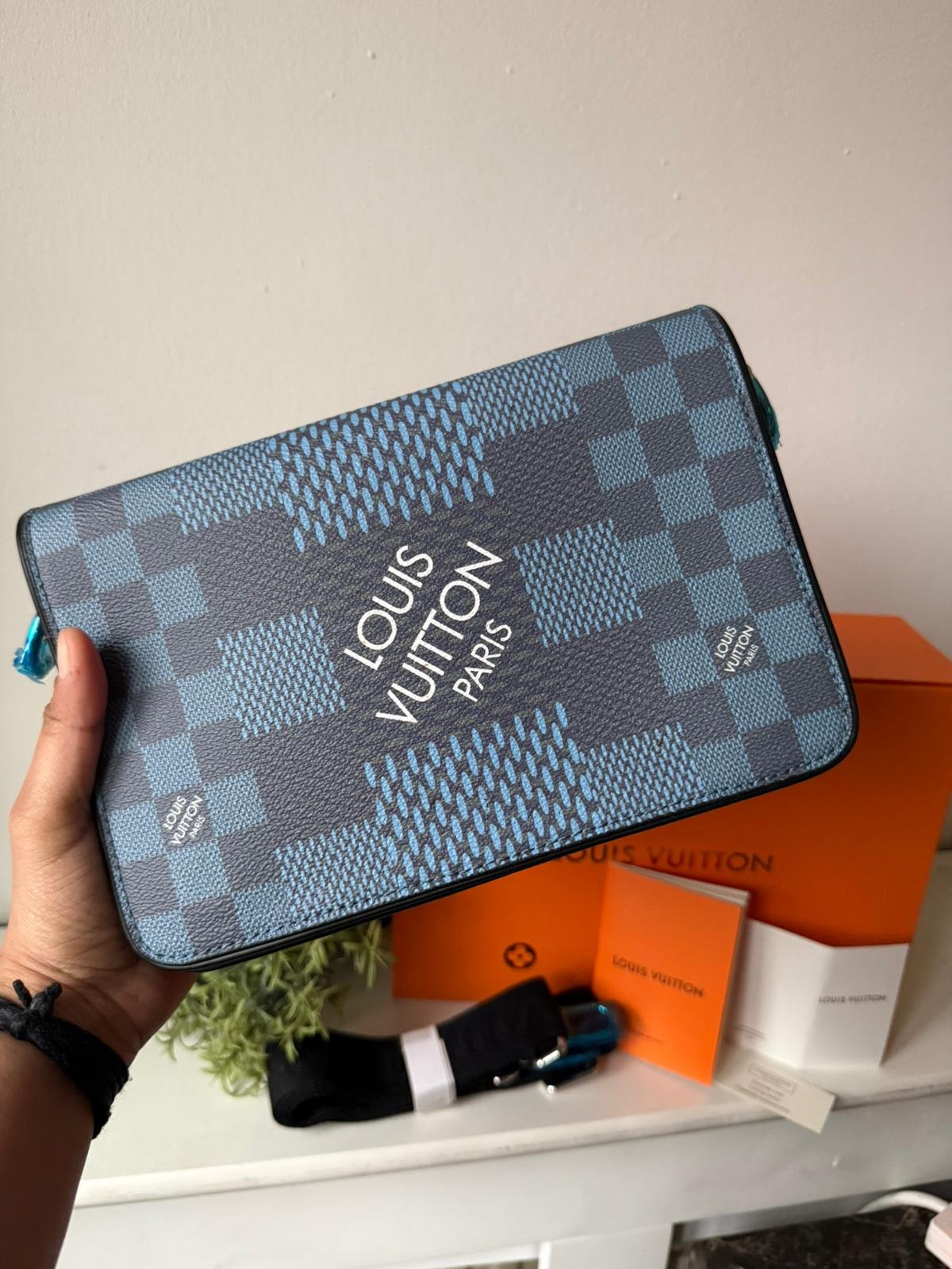 Blue Shoulder And Crossbody Bag in Damier Graphite 3D canvas with checkerboard pattern.