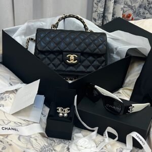 Caviar leather Mini Handy CC Flap Black with Classic Golden Hardware.