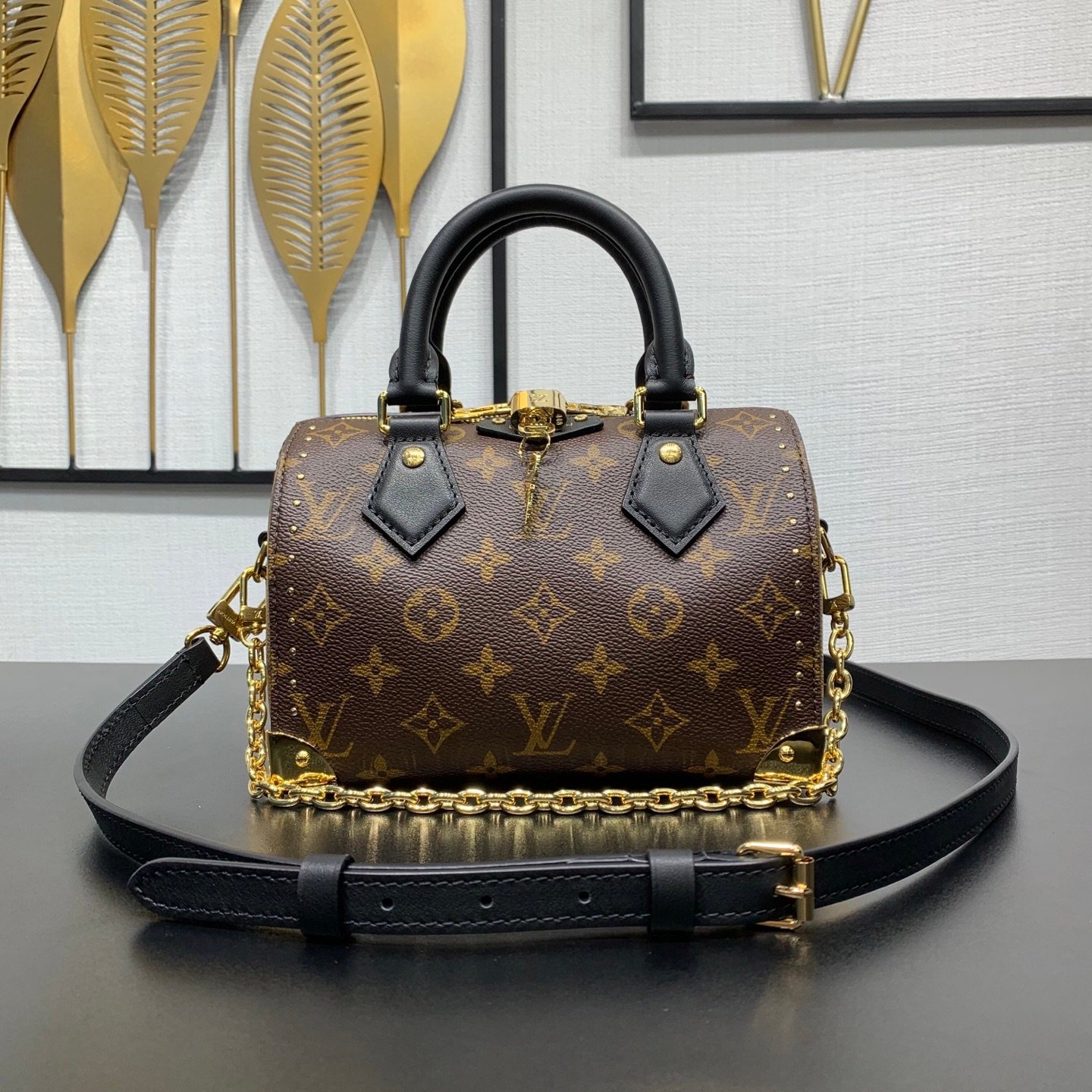 Speedy trunk handbag Monogram Canvas with Monogram Reverse trim.