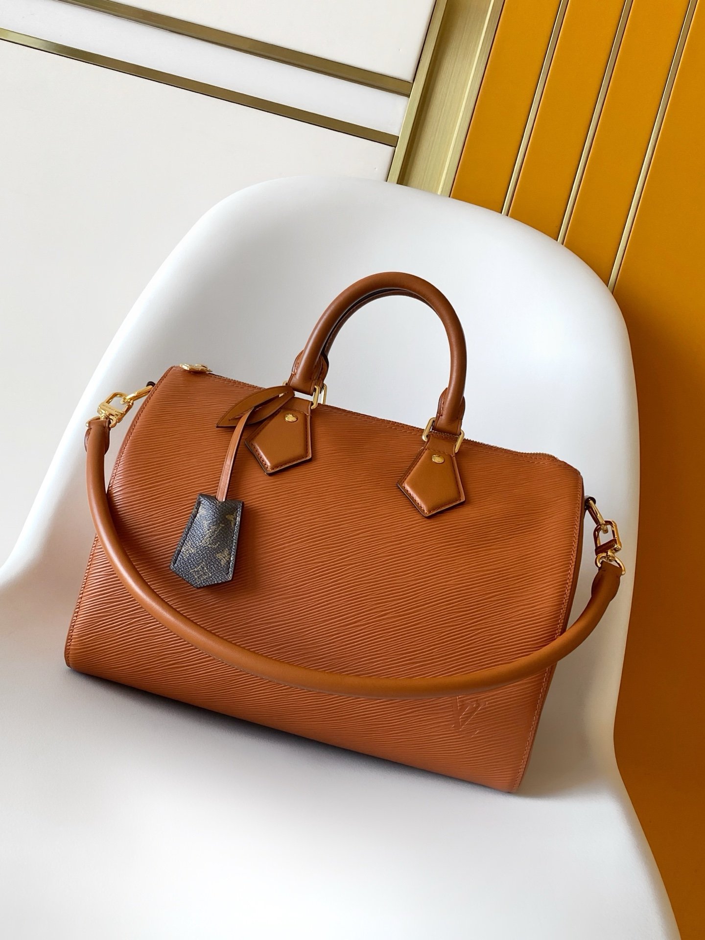 Tan brown Speedy 30 Basic and elegant travel bag made of cowhide leather.