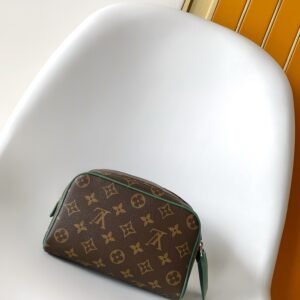 Dopp kit Mini wash bag Monogram Heritage coated canvas with cowhide details.