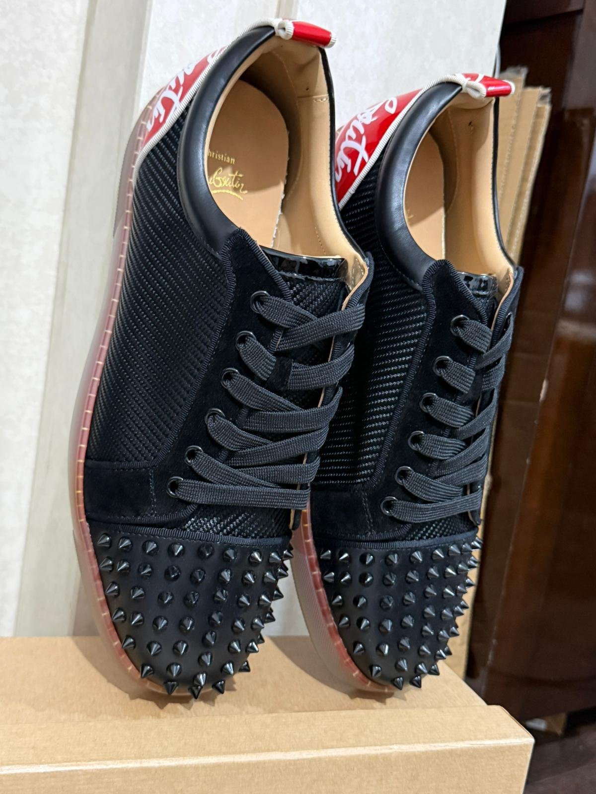 Loui$ Junior Spiked black sneakers with red accents SIZE 12.