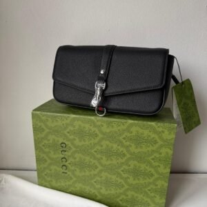 Black / Burgundy crossbody closure bag.