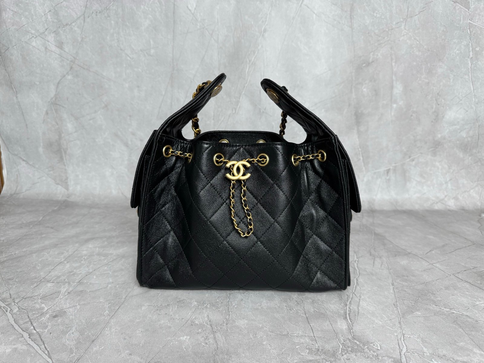 Black 25 Small Hobo Bag crafted from grained calfskin leather with gold-tone metal hardware.