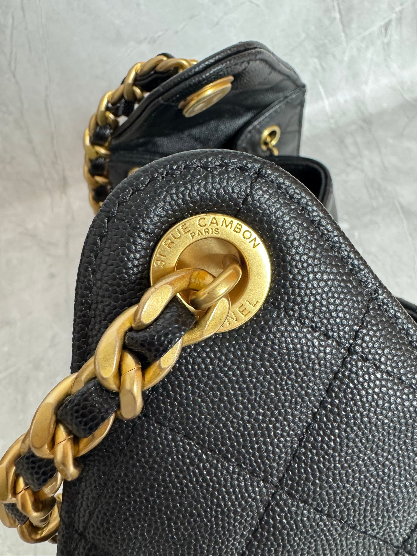 Black 25 Small Hobo Bag crafted from grained calfskin leather with gold-tone metal hardware. - Image 6