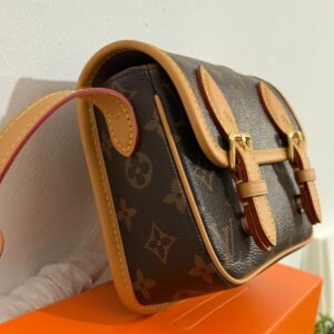 Alternative view of The Satchel Wearable Wallet in Monogram canvas with gold-tone hardware and adjustable shoulder strap.