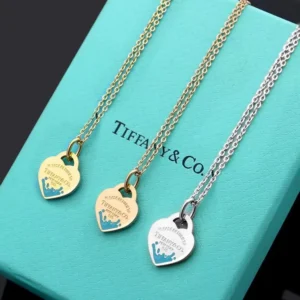 High quality heart necklace with tiffany blue splash on it.