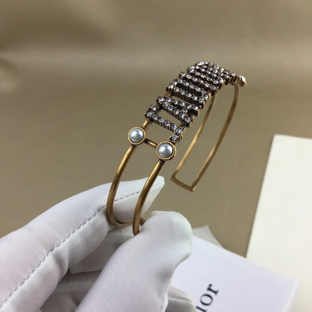 Gold bracelet/Bangle with J@D!0R cut out and pearls. - Image 6