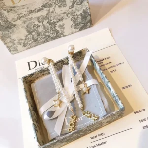 Alternative view of Dangle earrings with D!0r letter and pearls.