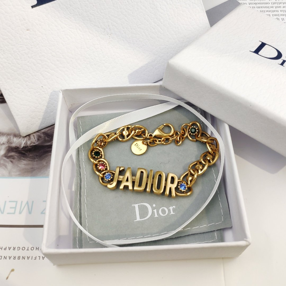 Linked chain Gold bracelet with J@D!0R cut out and Gems inlaid.