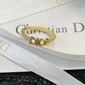 Silver /Gold ring with diamonds and brand name engraved.