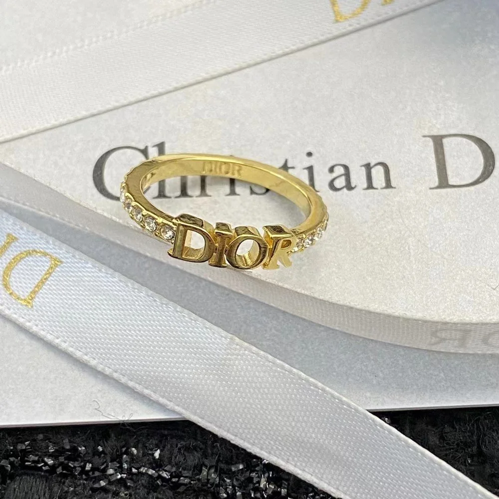 Silver /Gold ring with diamonds and brand name engraved.