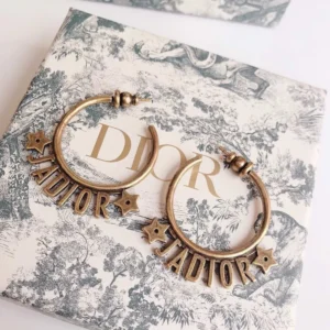 Golden Hoop earrings with J@D!0r cut out.