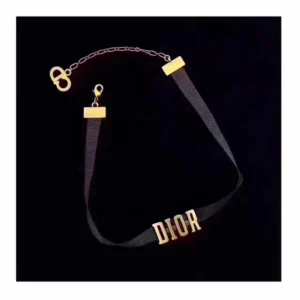 Choker necklace featuring a black grosgrain band and a gold-tone metal "D!0R" signature.