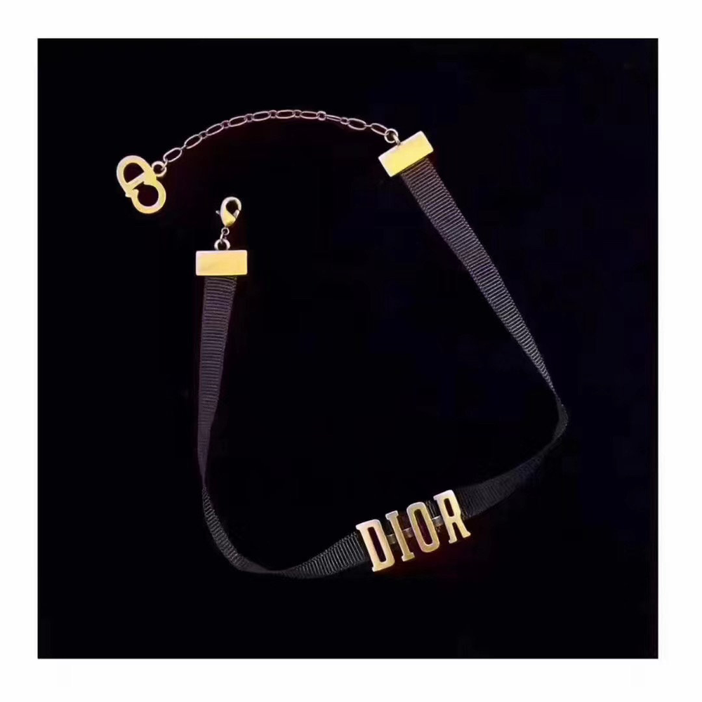 Choker necklace featuring a black grosgrain band and a gold-tone metal "D!0R" signature.