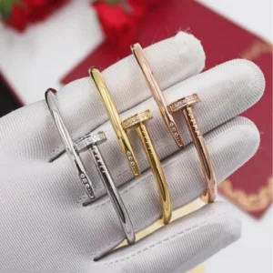 Iconic nail Bracelet with gems and diamonds 18K gold plated.