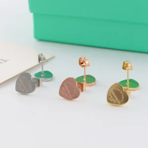 Alternative view of Heart-shaped stud earrings in  polished finish available in silver, rose gold, and yellow gold tones.