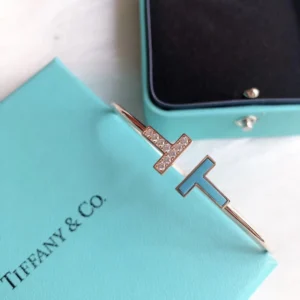 T bracelet with diamonds and tiffany blue touch.