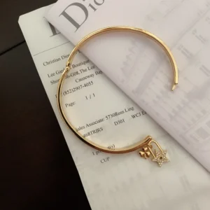 Alternative view of CD imprinted plain gold Bracelet /Bangle with star and clover leaf motif.