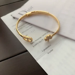 Alternative view of Plain gold Bracelet /Bangle with CD cutout and clover leaf motif.